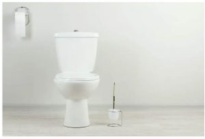 how to remove plastic nut from toilet tank