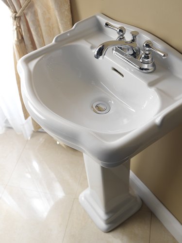 how to attach a pedestal sink to the wall